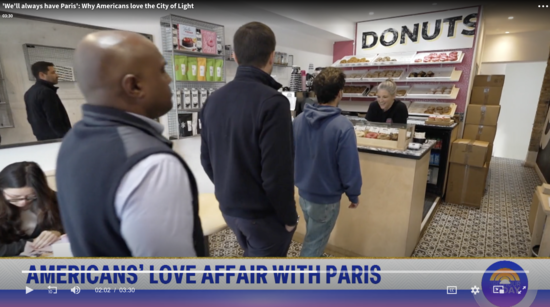 Screenshot from Today Show segment of people in line at Boneshaker Donuts and Amanda at the counter