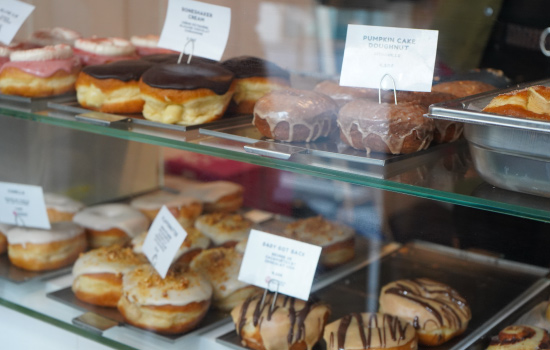A variety of fresh donuts in the case