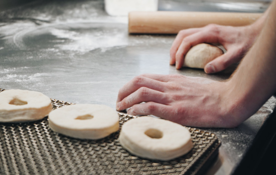 Handmaking doughnuts