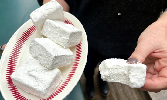 Amanda holding a plate of vegan marshmallows that she made for David Lebovitz